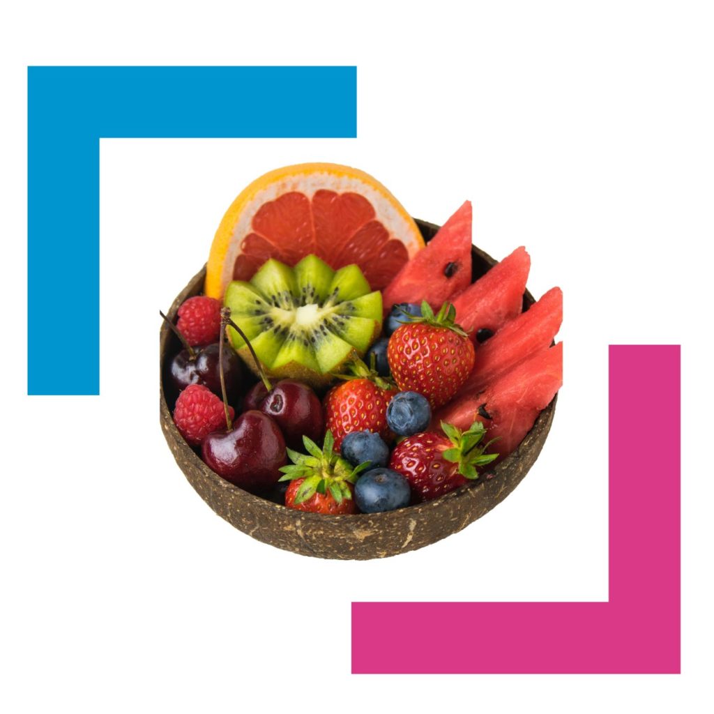 healthy bowl of fruit with Fiona Spence colours of blue and pink forming bars surrounding it